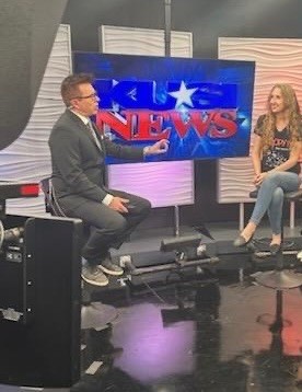 Taylor Fox being interviewed on the KUSI News set
